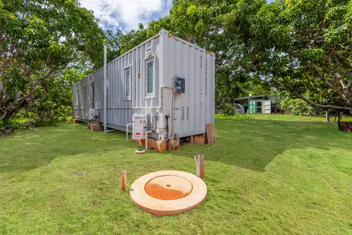 40ft container home set up on a suburban lawn