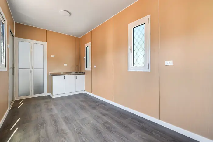 Kitchen and living area inside a 40ft two-bedroom container home