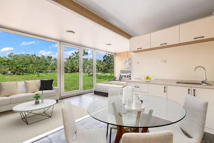 Furnished living and kitchen space inside The Infinity Cube
